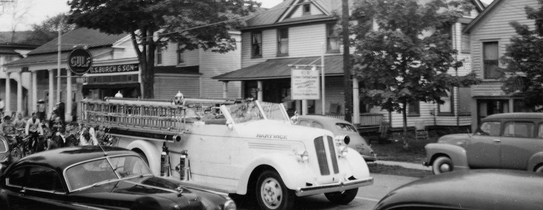 Historical photo of fire trucks on Main Street