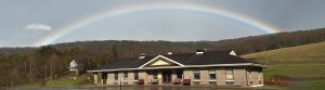 Hartwick Town Hall with Rainbow Overhead
