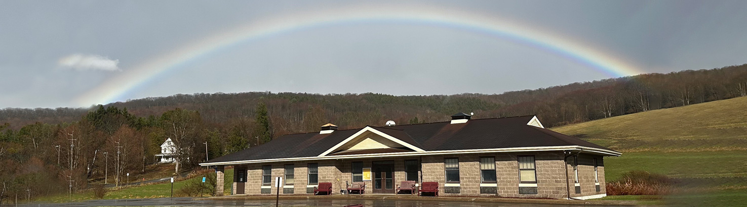 Hartwick Town Hall with Rainbow Overhead